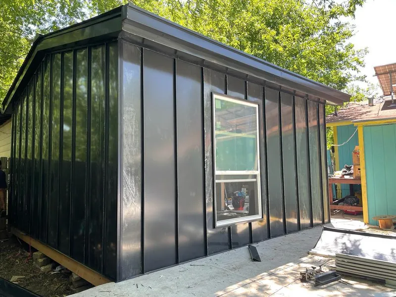 Black standing seam metal wall panels for Roof Inspection in Fishers